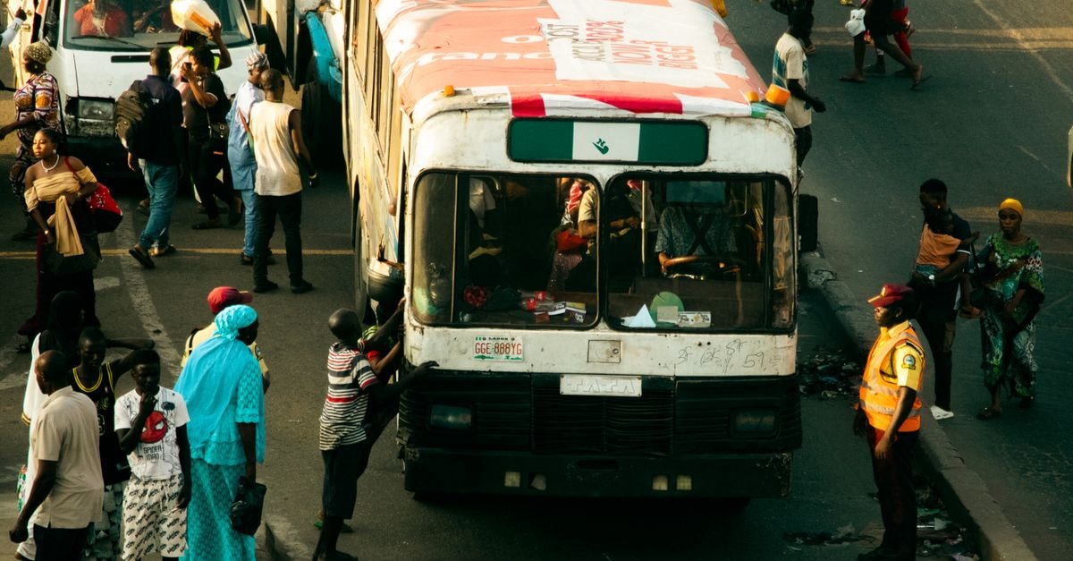 Ikeja, Lagos Travel Guide: Calm Corners and City Rhythm A bustling street in Lagos, Nigeria, capturing daily life and transportation activities.