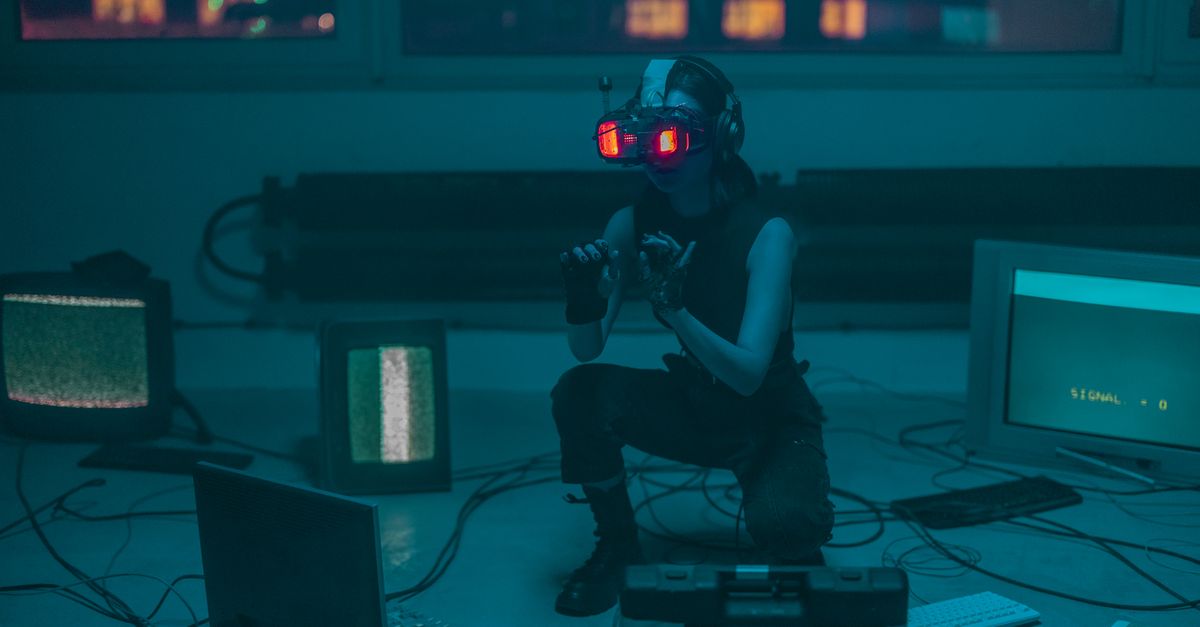 Meccha Chameleon ranks second in June PC revenue as Steam Frame VR launch approaches A woman crouching with VR headset in a sci-fi room filled with digital screens.