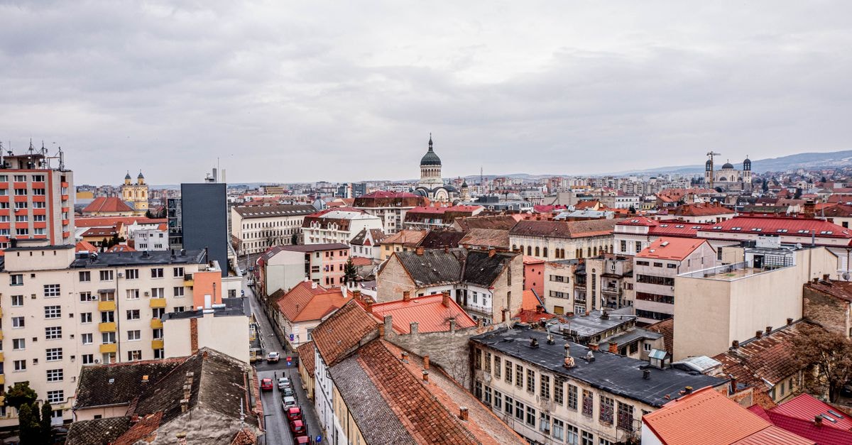 Hotel Opera in Timișoara: Central Stay with Spacious Rooms Aerial view of a European cityscape with historic buildings and urban skyline.