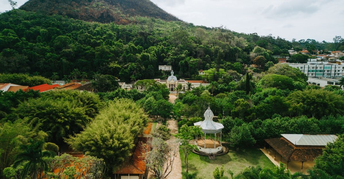 Montes Claros Travel Guide: Planning Tips, Costs and Things to Do Explore Caxambu's lush park with hills in the background, a serene urban escape in Brazil.