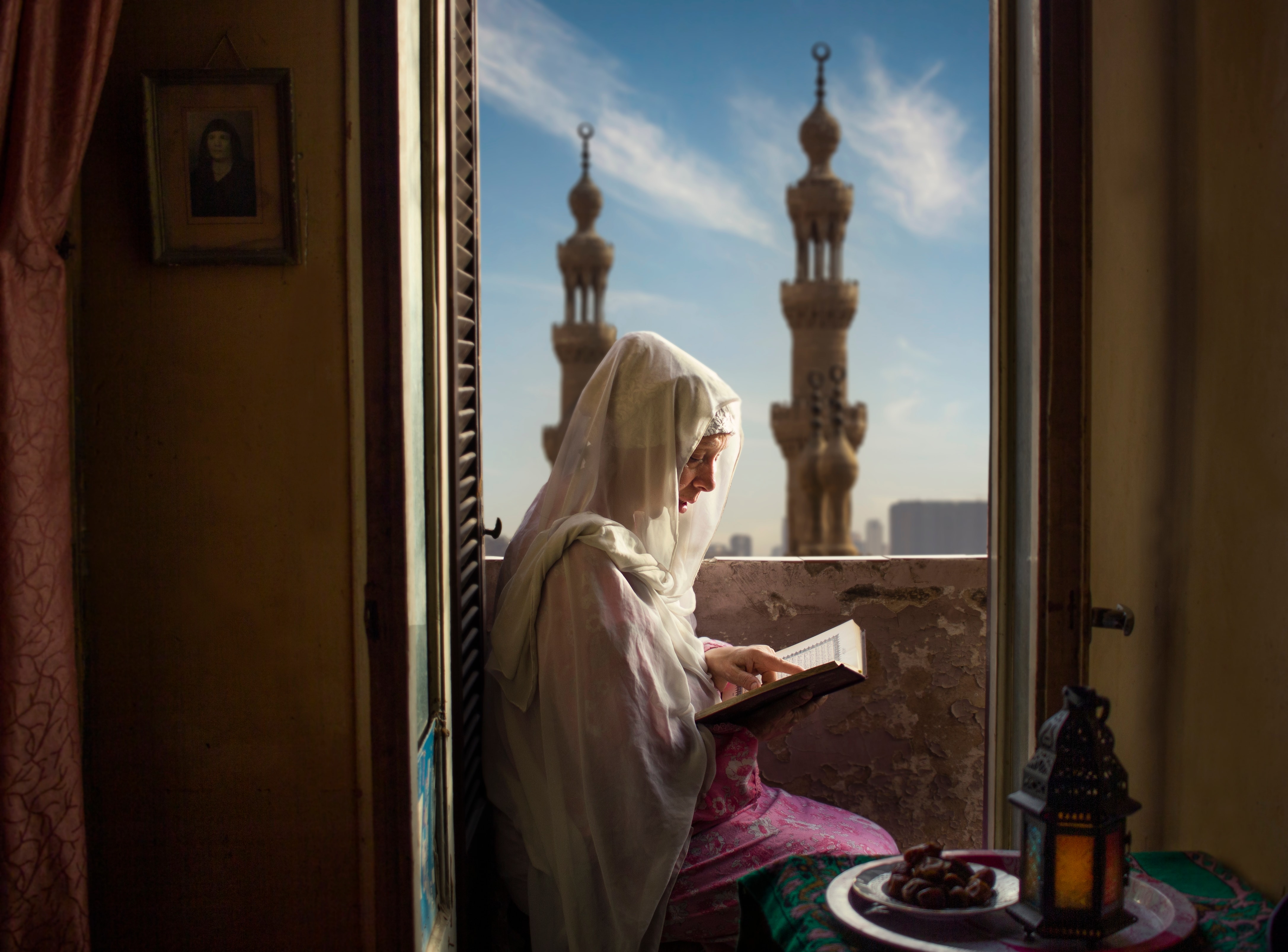 Illustration for Reading International: A Cinema and Real Estate Hybrid Priced for a Recovery the Filings Don't Yet Confirm: Woman reading the Quran during Ramadan in Cairo, Egypt.jpg