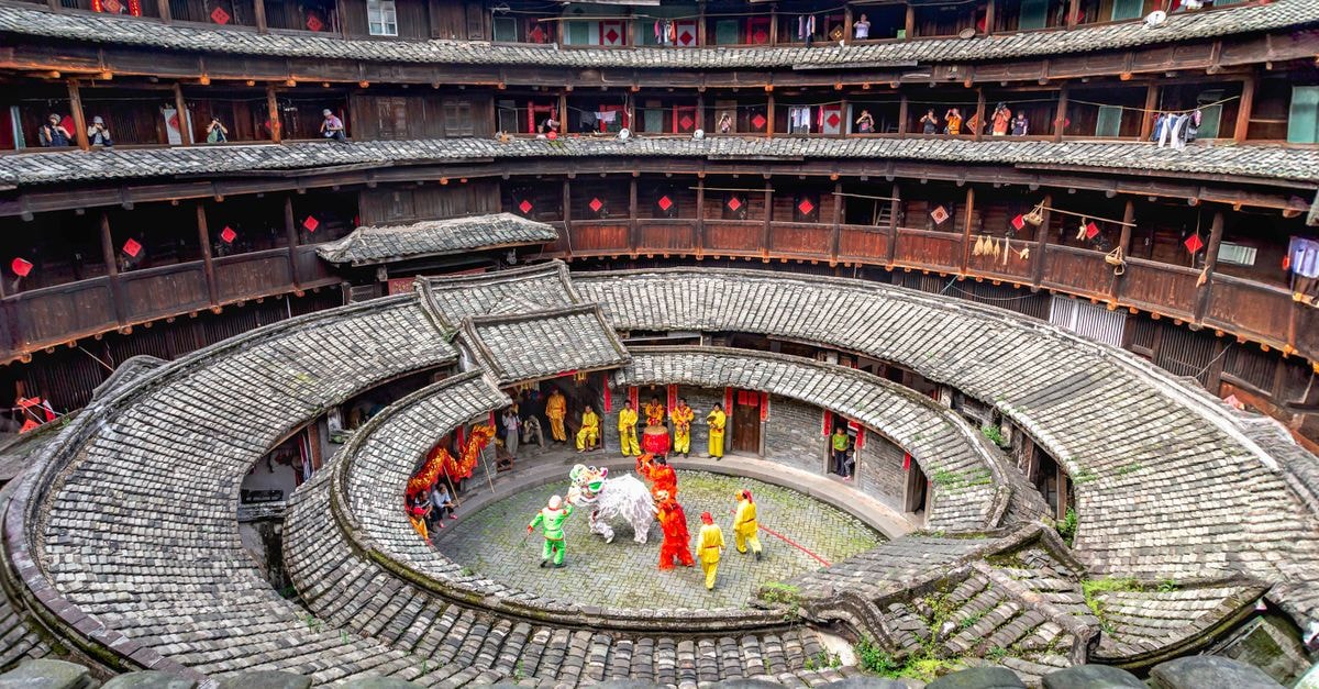 Colorful Lion Dance in Fujian Tulou, showcasing Chinese culture.