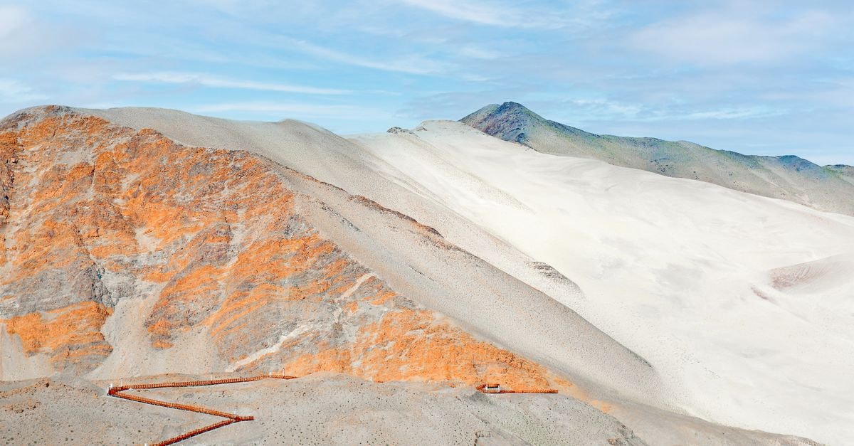 Comfort Hotel Yamagata in Yamagata: Step Across From JR Yamagata Station Vast desert landscape featuring red dunes and clear blue sky, perfect for travel and adventure themes.