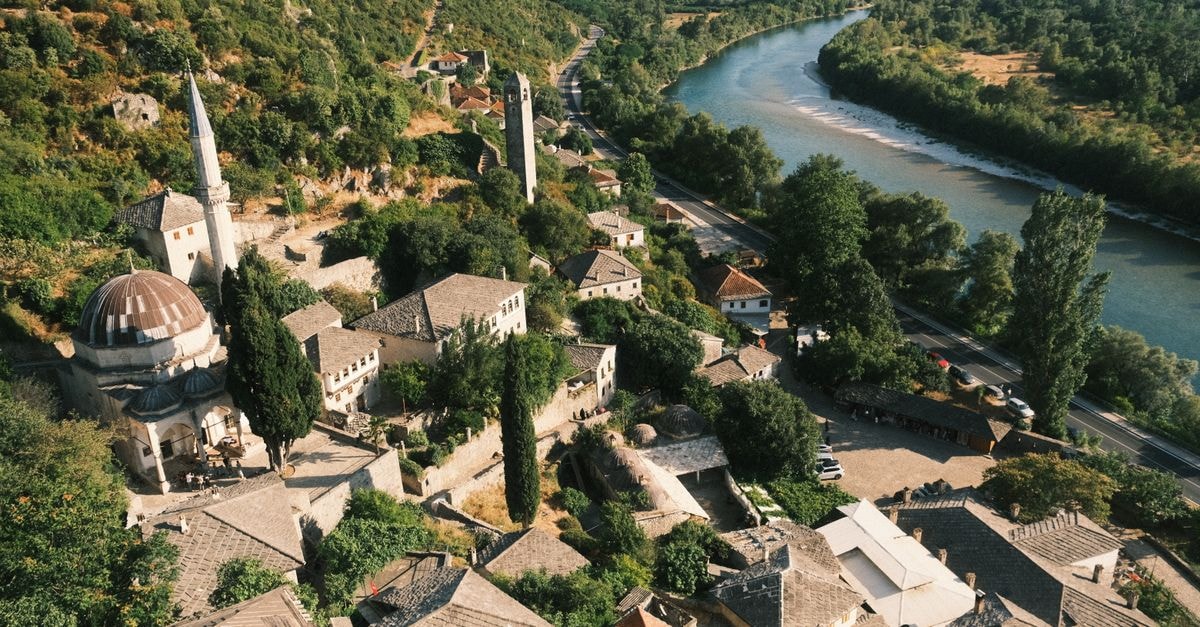 Explore the scenic beauty of Počitelj village with its Ottoman architecture and the winding Neretva River.