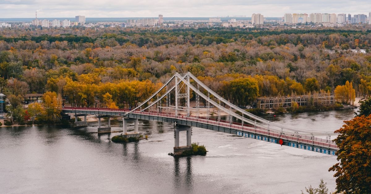 Hyatt Regency Kyiv in Kyiv: Old City Views from the Heart of the Capital Beautiful aerial view of the pedestrian bridge over the river in autumn in Kyiv, Ukraine.