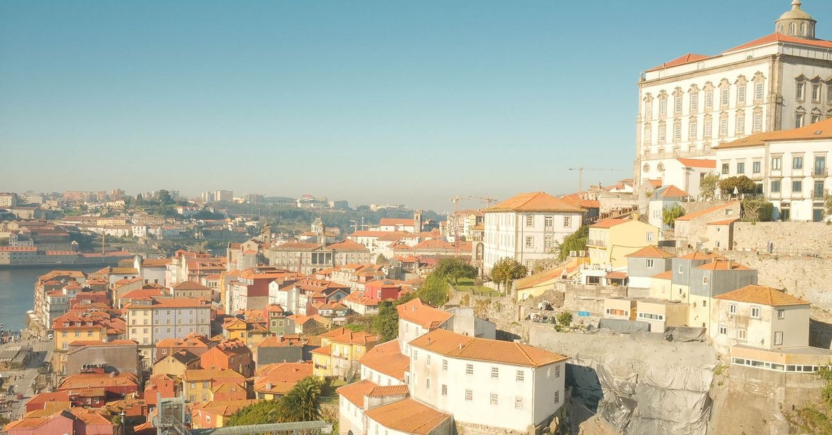 Exe Almada Porto in Porto: A Heritage Façade in the Historic Centre Aerial view of Porto, Portugal showcasing historic architecture and vibrant rooftops under a clear sky.
