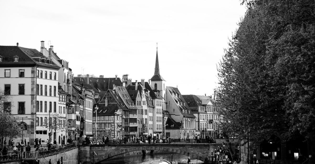A classic black and white view of Strasbourg's historic architecture along the River Ill.
