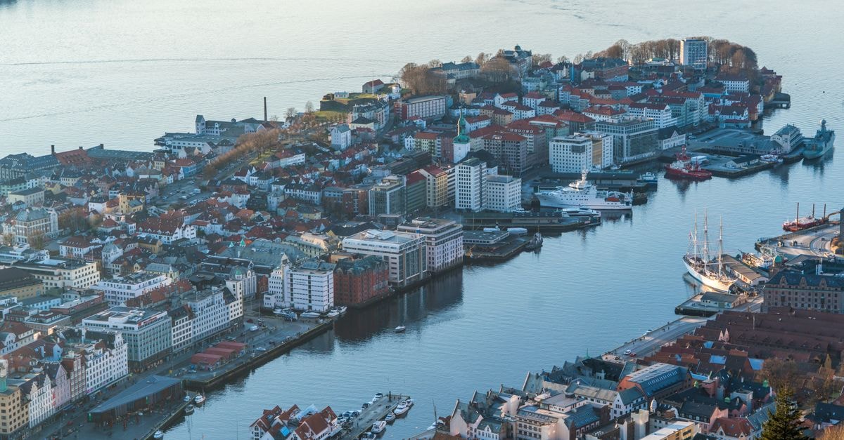 A Travel Guide to Tønsberg, Norway's Oldest City A breathtaking aerial shot of Bergen, Norway, showcasing the harbor and cityscape with boats and waterfront buildings.