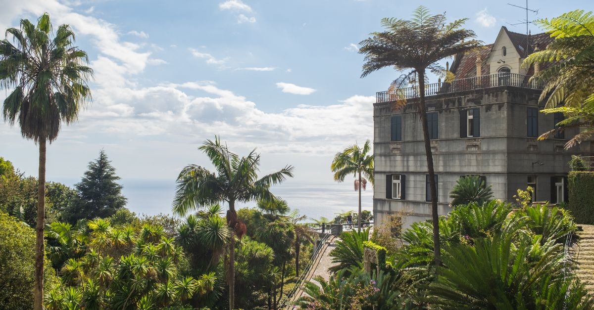 A historic villa with tropical gardens overlooking the ocean in Madeira, Portugal.