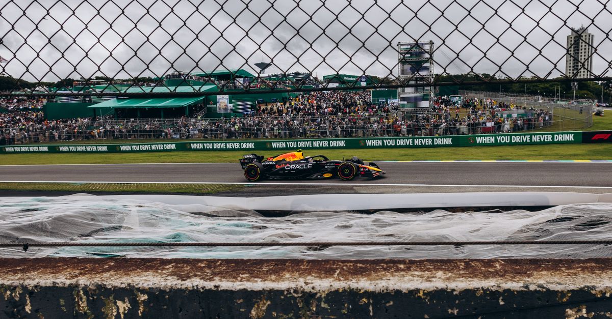 Exciting Formula 1 race captured at Interlagos Circuit, showcasing speed and vibrant crowd.