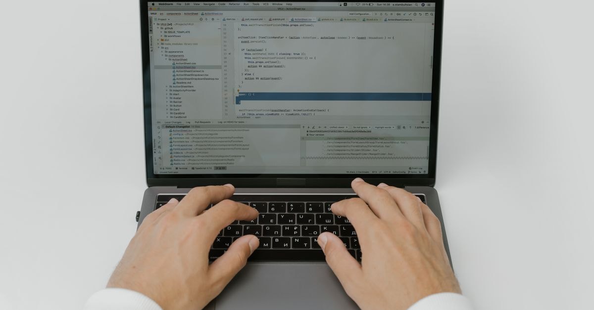 Oracle's Kubernetes Engine Adds Three Optional GPU Workload Add-ons Close-up of hands coding on a laptop, showcasing software development in action.