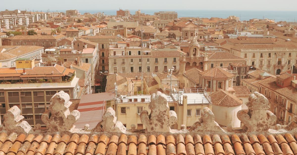Ruzawi Executive Lodges in Marondera: A Guest House in Mashonaland East Aerial view of Catania cityscape with sea in the background, showcasing the historic architecture.