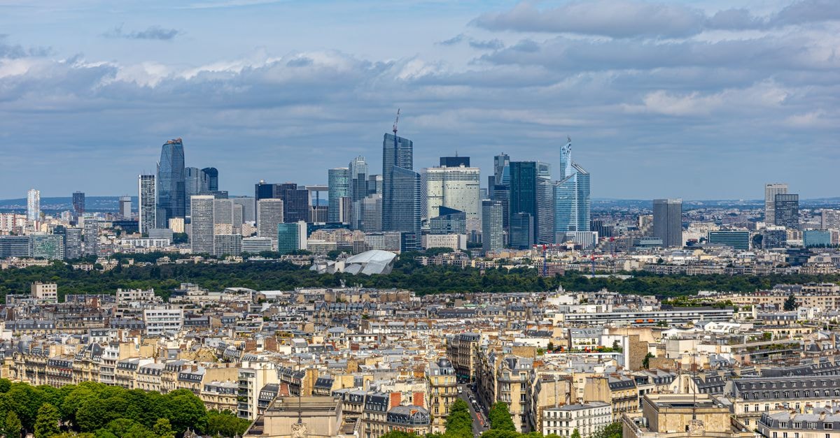 Aerial view of La Défense skyline in Paris with urban architecture and cityscape.