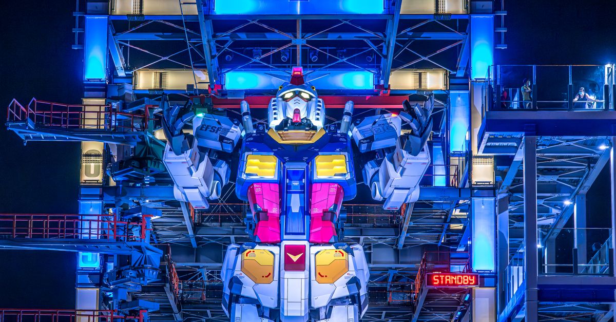 New Anime Slate Unveiled: Netflix's Annecy Showcase, SDCC's Gundam Reveal, and Avatar: Seven Havens Premiere Date Illuminated Gundam robot at Yokohama's Gundam Factory lit up at night. Vibrant colors and futuristic design.