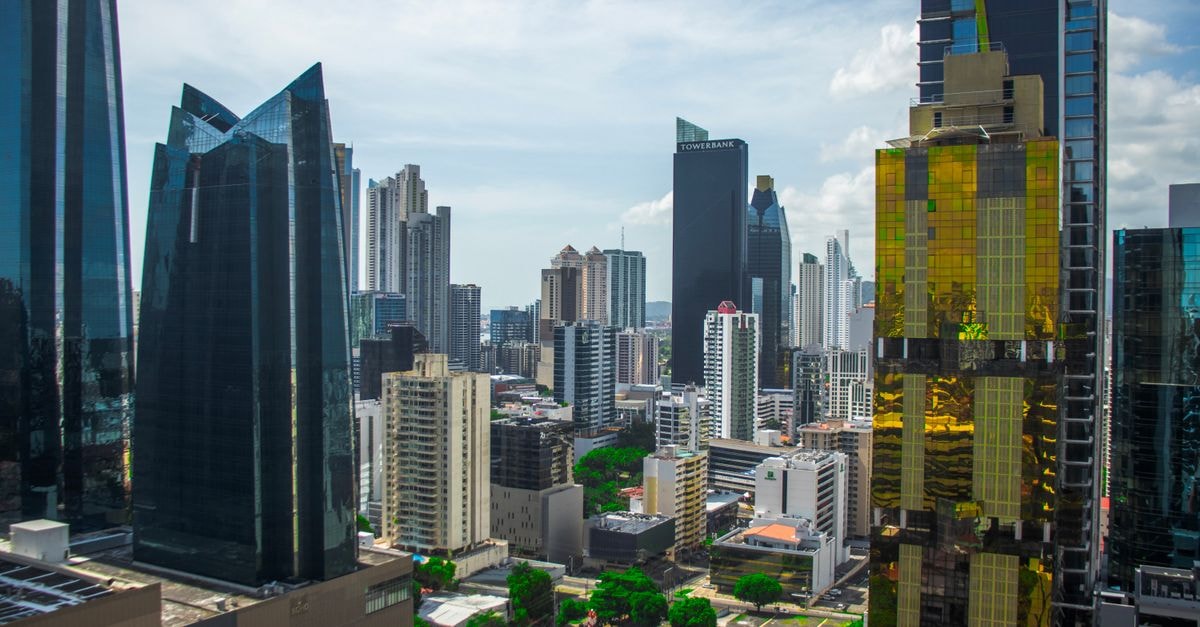 Modern skyscrapers rise in Panama City's financial district on a clear day.