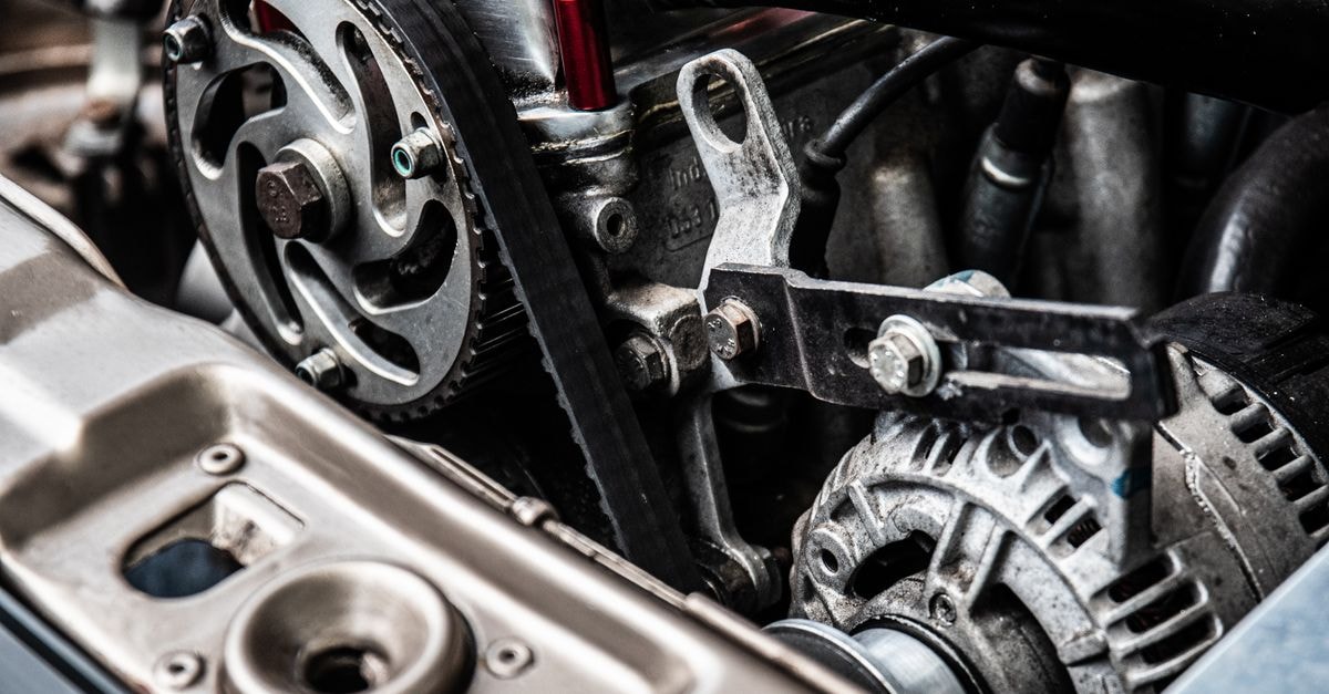 High-resolution close-up of a car engine showing intricate mechanical parts and metallic details.