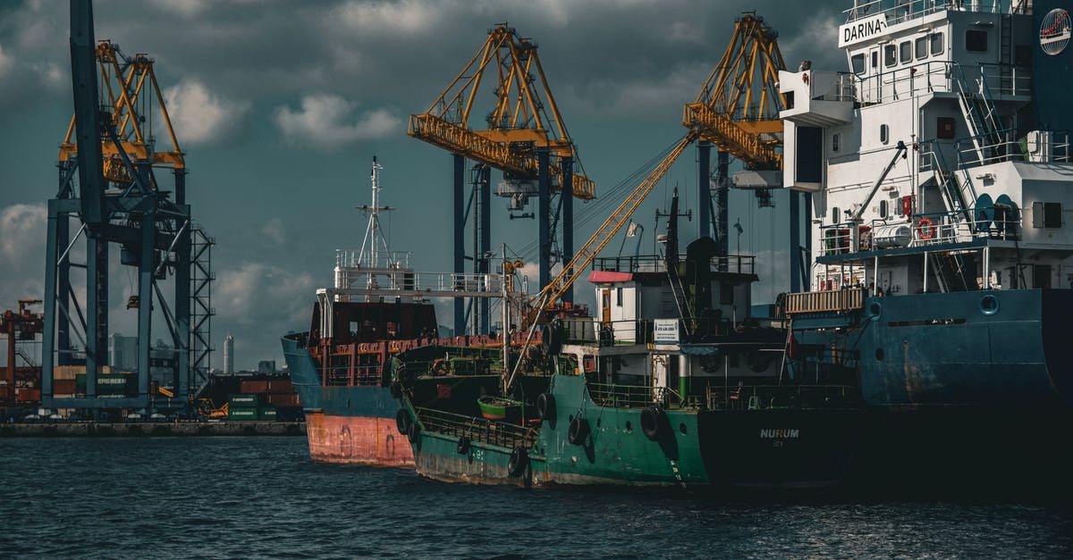 MasterCraft Boat Holdings: A Premium Boat Roll-Up With Cyclical Earnings and an Untested Margin Story Cargo ships and cranes in an industrial port in Istanbul. Captured on a cloudy day.