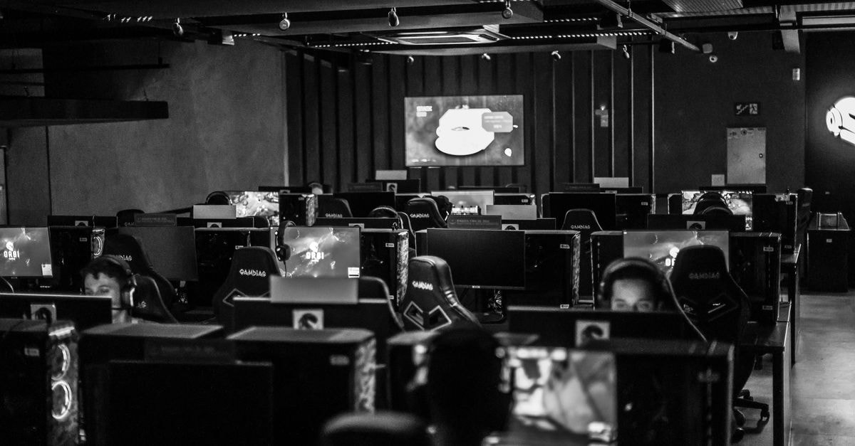 Sony launches free ad-supported Live TV service on PS5 in the U.S. with sports, movies and anime channels Black and white view of an active esports gaming studio with players immersed in video games.