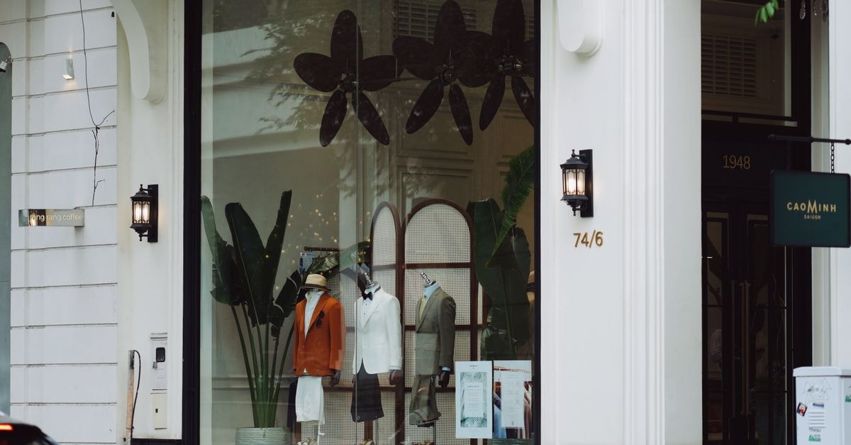 Boutique in Nonthaburi: A Calm Stop Near Ngam Wong Wan Stylish fashion boutique display with elegant mannequins and decor in a modern storefront.