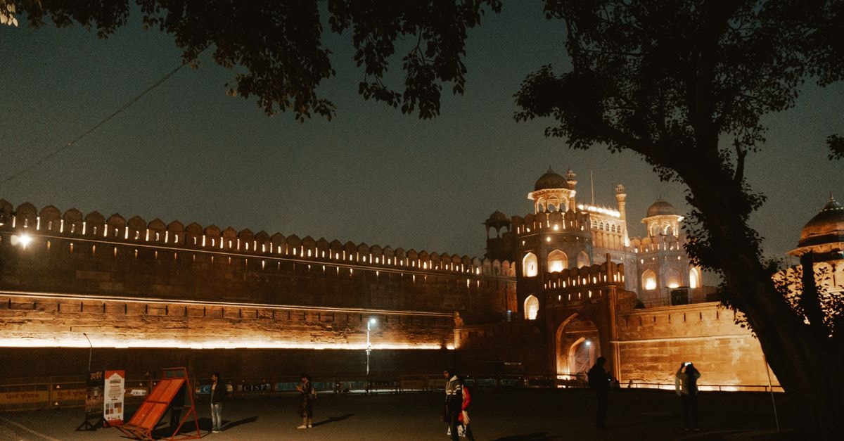 Narela, Delhi Travel Guide: Northern Suburban District Tips Illuminated view of the historic Red Fort in New Delhi at night, highlighting its architectural beauty.