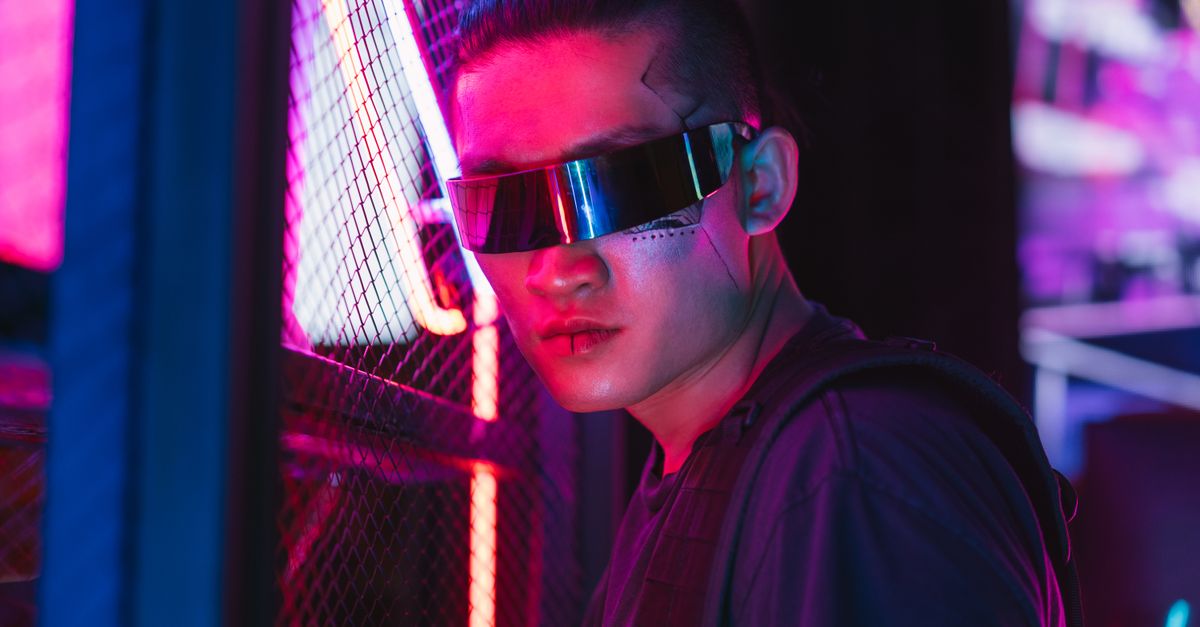Samsung details lighter Galaxy AI glasses design, targets premium segment ahead of launch A futuristic man in cyberpunk style with neon lights, showcasing cool fashion and tech.