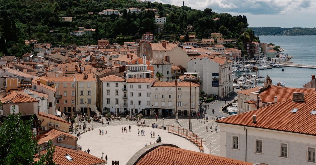Benečanka Casa Veneziana in Piran: A 15th-Century Venetian House on Tartini Square A picturesque aerial view of Piran, Slovenia, showcasing historic architecture and beautiful coastline.