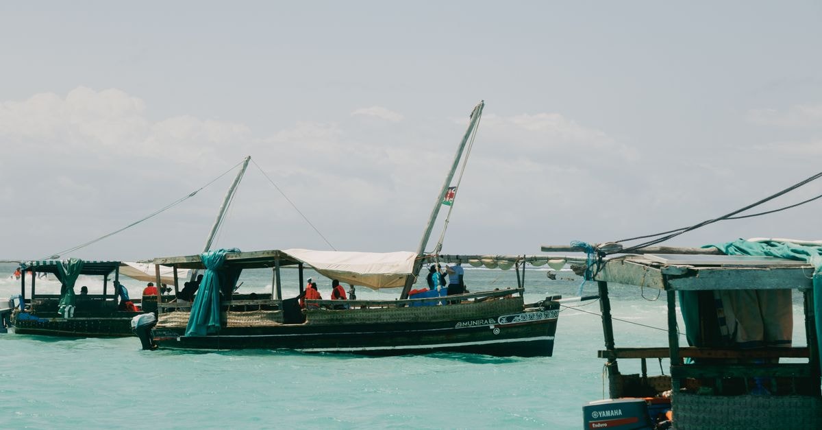 Hotel Sapphire in Mombasa: An Urban Retreat on Mwembe Tayari Road Traditional fishing boats in Mombasa harbor on a sunny day, showcasing local culture.