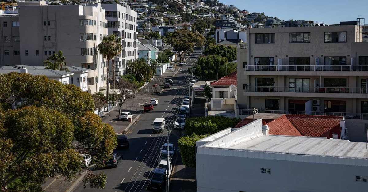 Aerial view of Cape Town's residential streets with modern architecture during daytime.