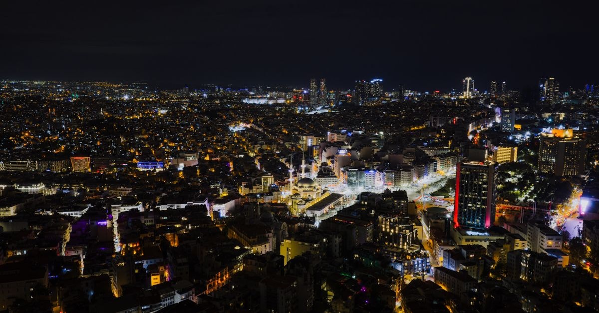 Nearport Hotel in Sultanbeyli: An Airport-Edge Stay on Osmanlı Bulvarı Stunning aerial view of Istanbul at night with city lights illuminating the urban landscape.