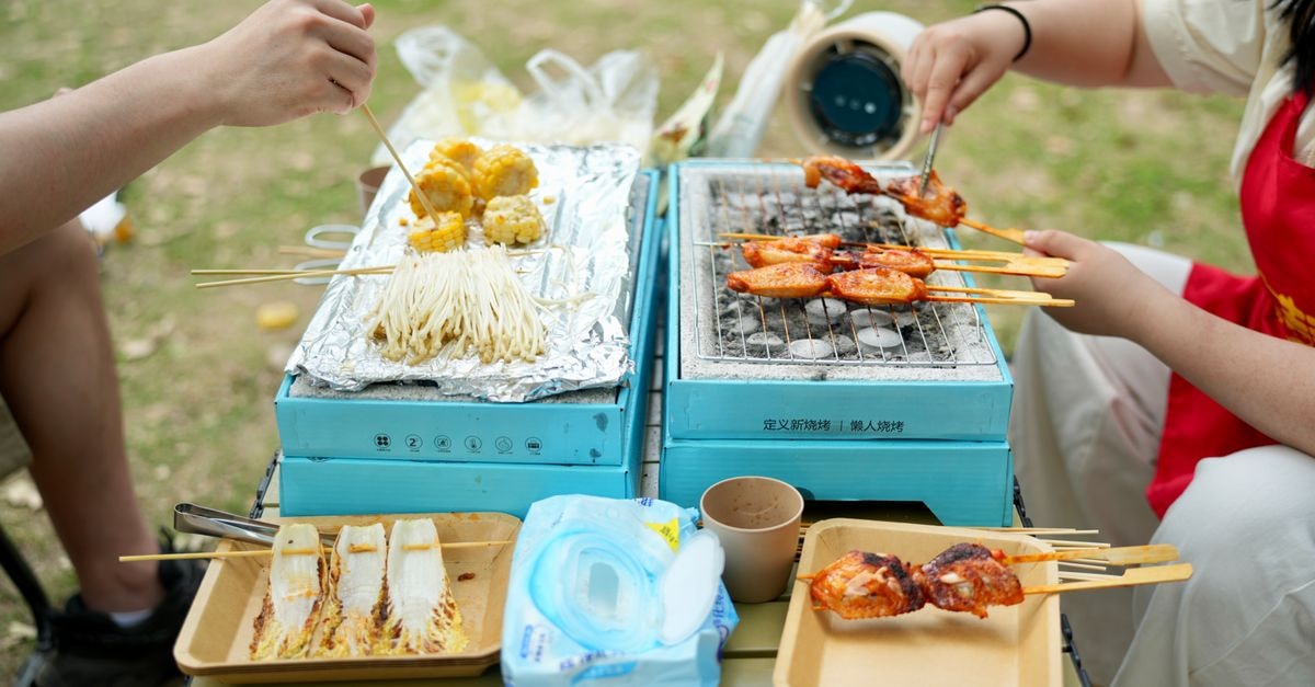 Hongseong Travel Guide: Barbecue, Food, and Practical Planning Enjoy a vibrant outdoor barbecue with skewers and snacks on portable grills.