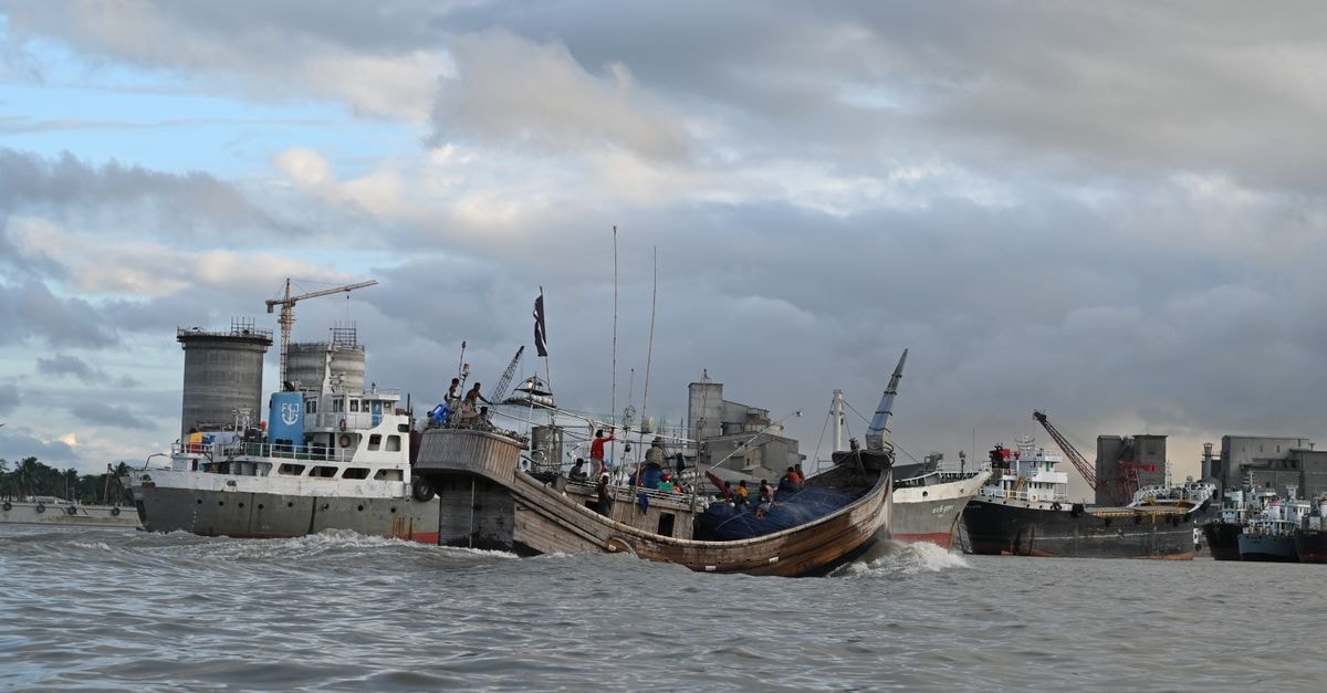 Chittagong travel guide: the Port City at a steady pace Dynamic scene of cargo ships at Chattogram port in Bangladesh, showcasing maritime activity.