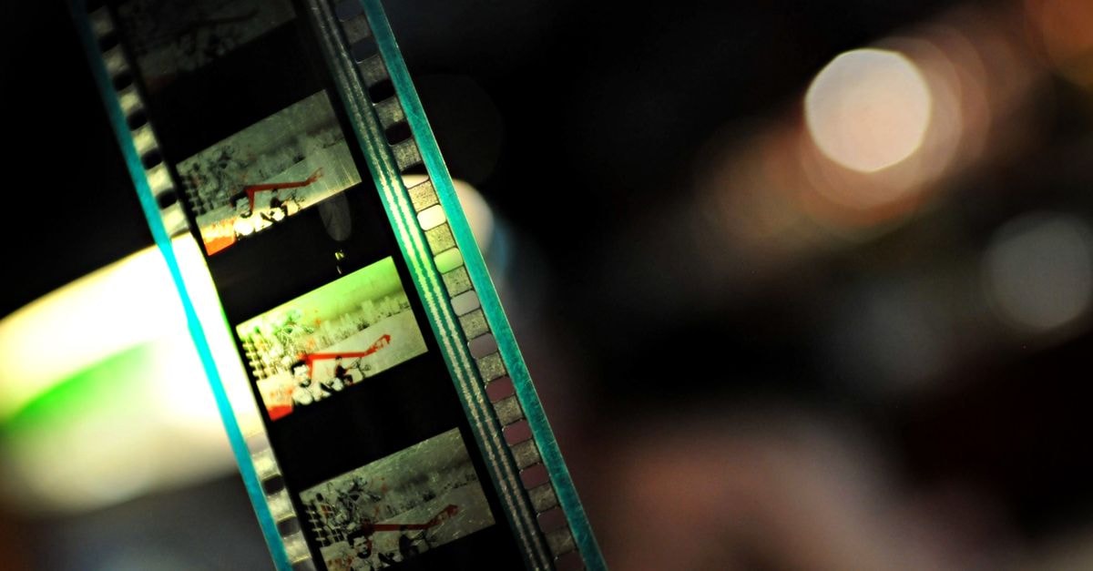 Avengers: Endgame Encore Opens to $86M Worldwide, Edges Closer to Avatar's All-Time Record Detailed close-up of a film strip with colorful lights and soft bokeh in the background, creating a nostalgic feel.