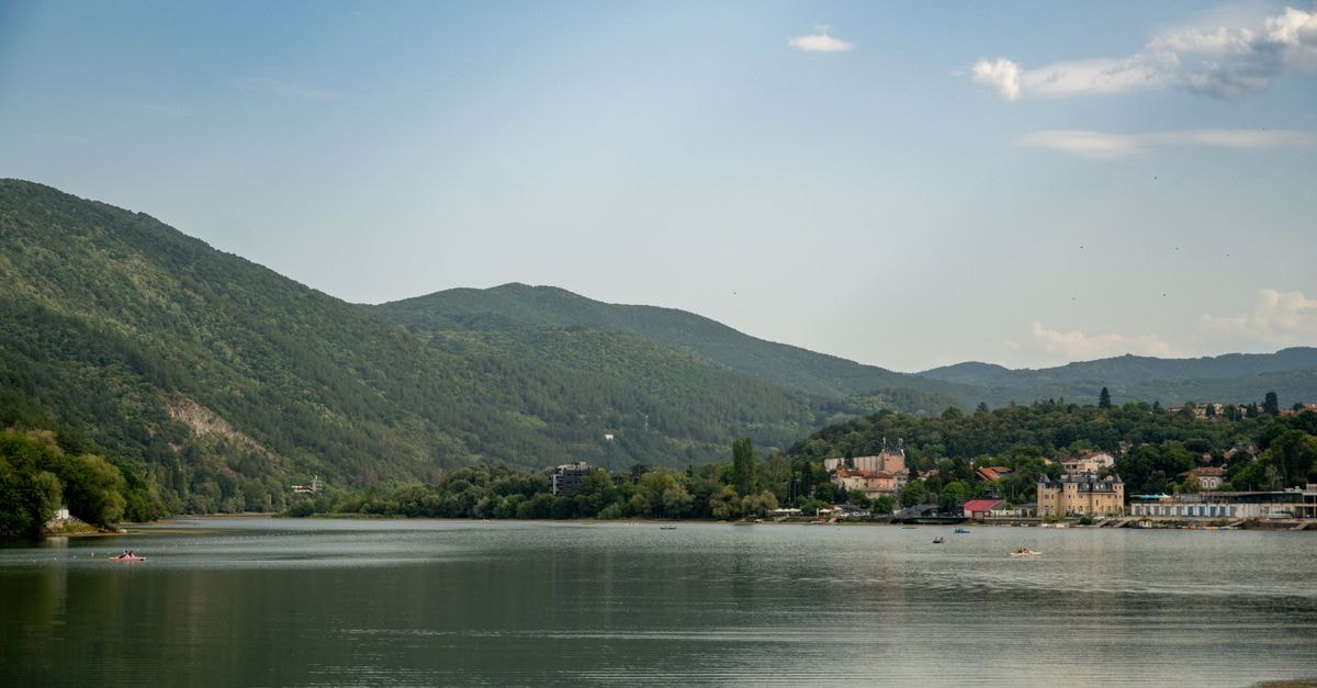 A Quiet Bulgarian Danube Town: A Silistra Travel Guide Idyllic summer landscape of Pancharevo Lake with lush hills and serene waters near Sofia, Bulgaria.