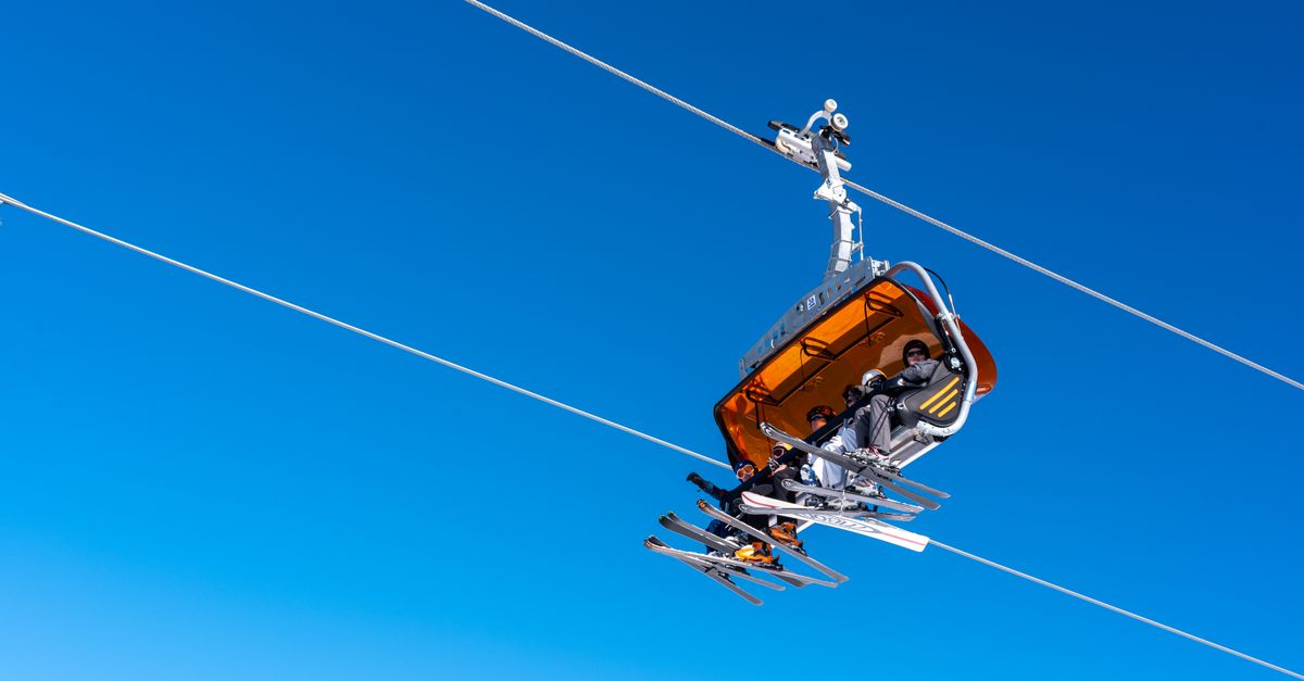 Afriski Mountain Resort draws skiers to Lesotho's high-altitude slopes Ski lift carrying skiers against a clear blue sky in Białka Tatrzańska, Poland.