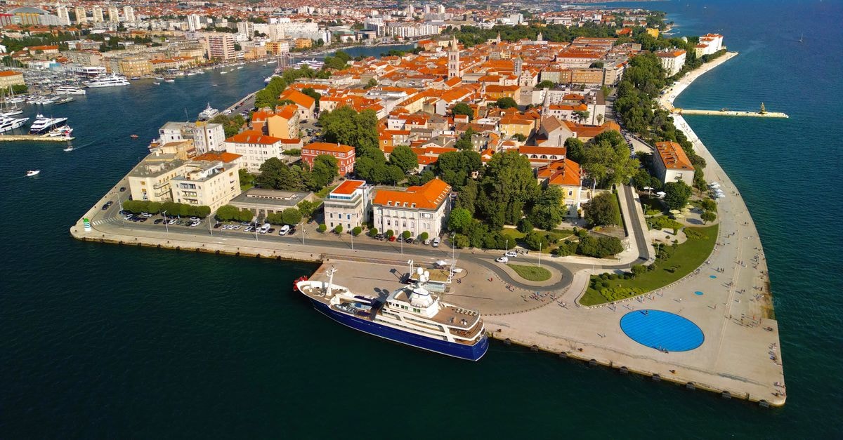 Hotel Capodistria in Koper: a coastal Slovenian base A stunning aerial view of Zadar's historic waterfront, showcasing the blend of urban architecture and scenic coastlines.