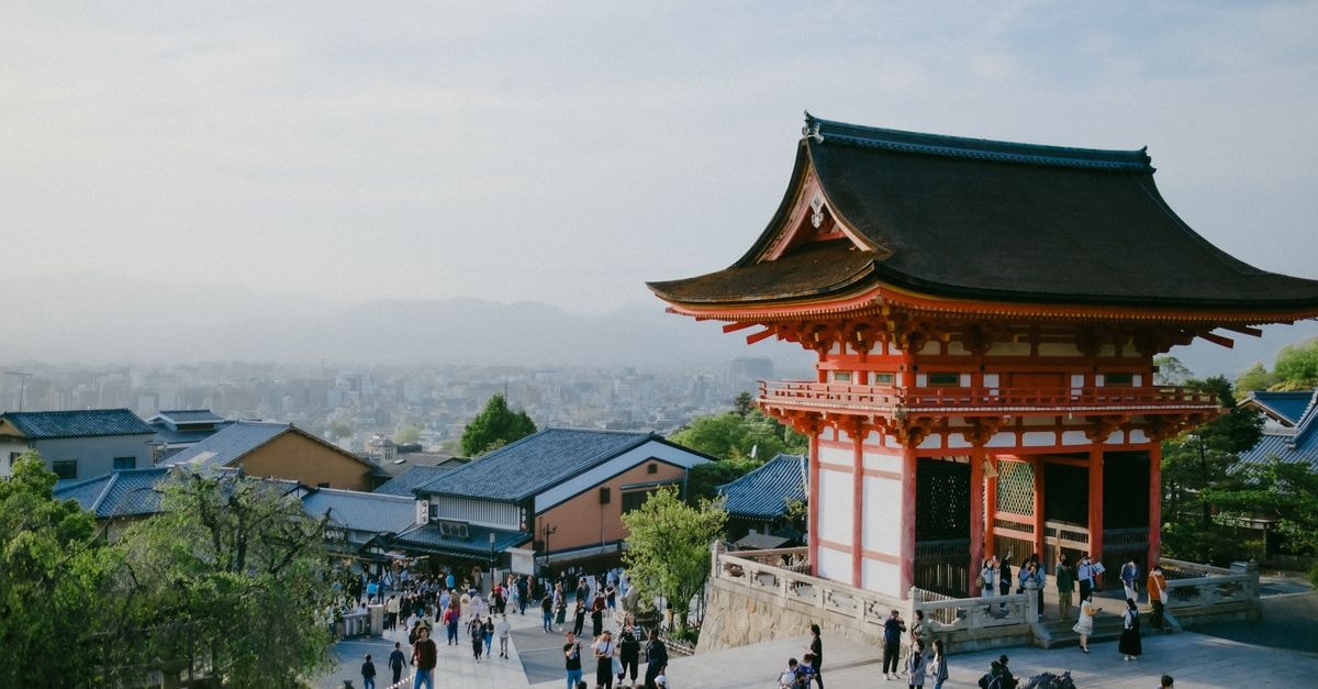 Yamagata City Travel Guide: Hot Springs, Mountain Temples and Local Soba Kiyomizu-Dera Temple in Kyoto with cityscape in background, capturing cultural and urban blend.