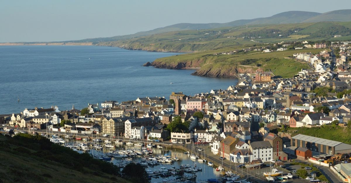 A picturesque view of Peel marina and town on the Isle of Man, showcasing the coastline.