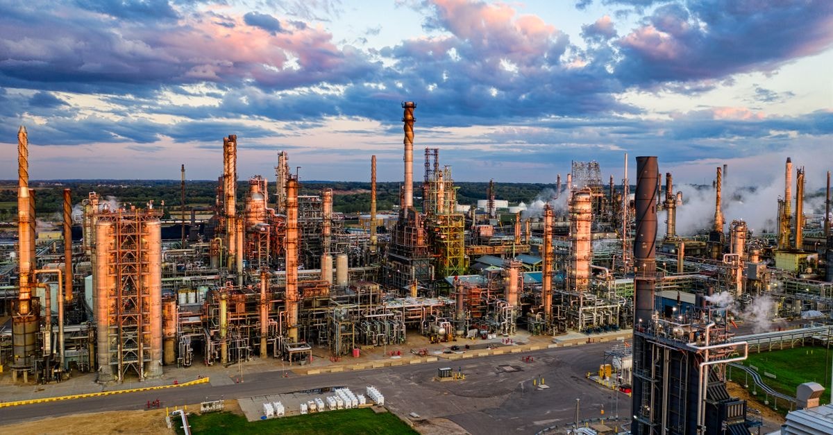 Crude oil posts third straight gain as U.S.-Iran strikes dim hopes for Strait of Hormuz deal Stunning aerial shot of an oil refinery in Rosemount, MN, showcasing industrial complexity at sunset.