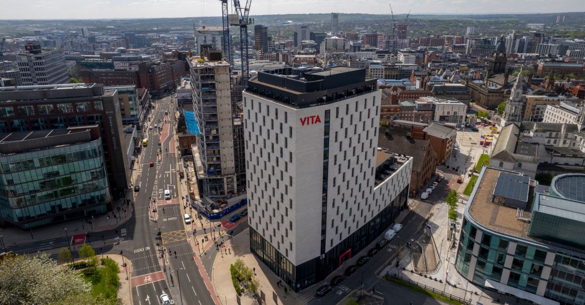 Leeds travel guide: discovering skyline landmarks and northern food culture Aerial shot capturing modern architecture in Leeds, England under sunny skies.