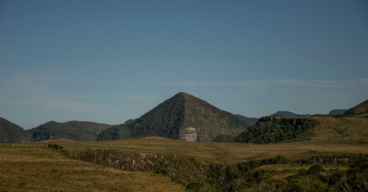 Taboao da Serra Travel Guide: Planning Tips, Costs and Things to Do Vast green landscape with hills and mountains under a clear blue sky in Urubici, Brazil.