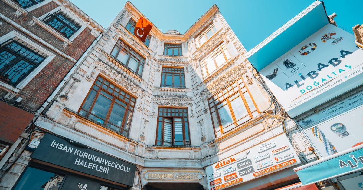 A vibrant low angle view of a historical Turkish building facade on a sunny day.