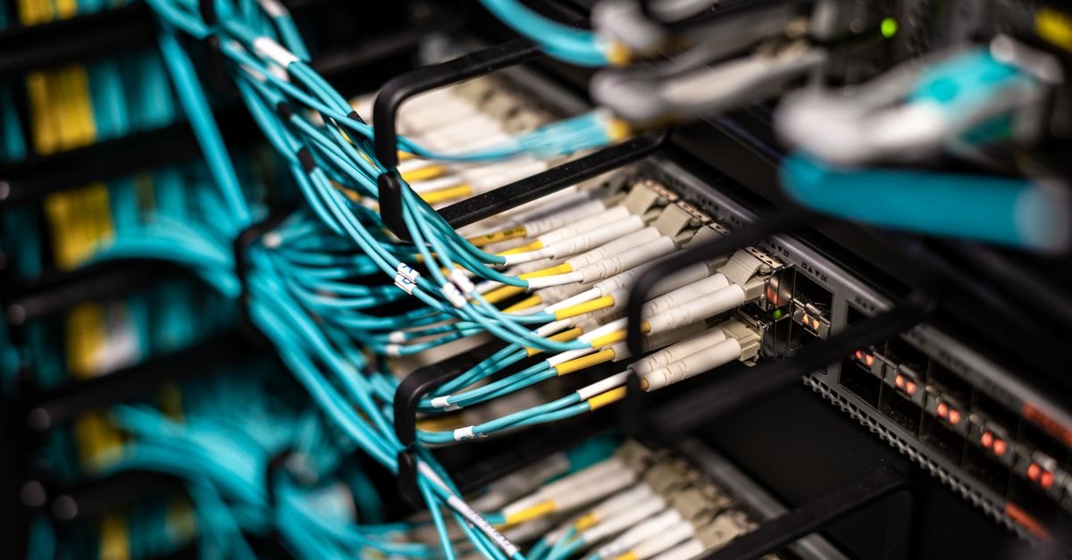 Oracle deepens Google Gemini AI integration and faces scrutiny over Wisconsin data center collateral Numerous wires and cables mounted into server patch panel in modern data center