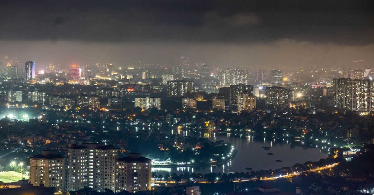 Stunning aerial view of Hanoi cityscape at night showing the vibrant urban landscape with illuminated buildings.