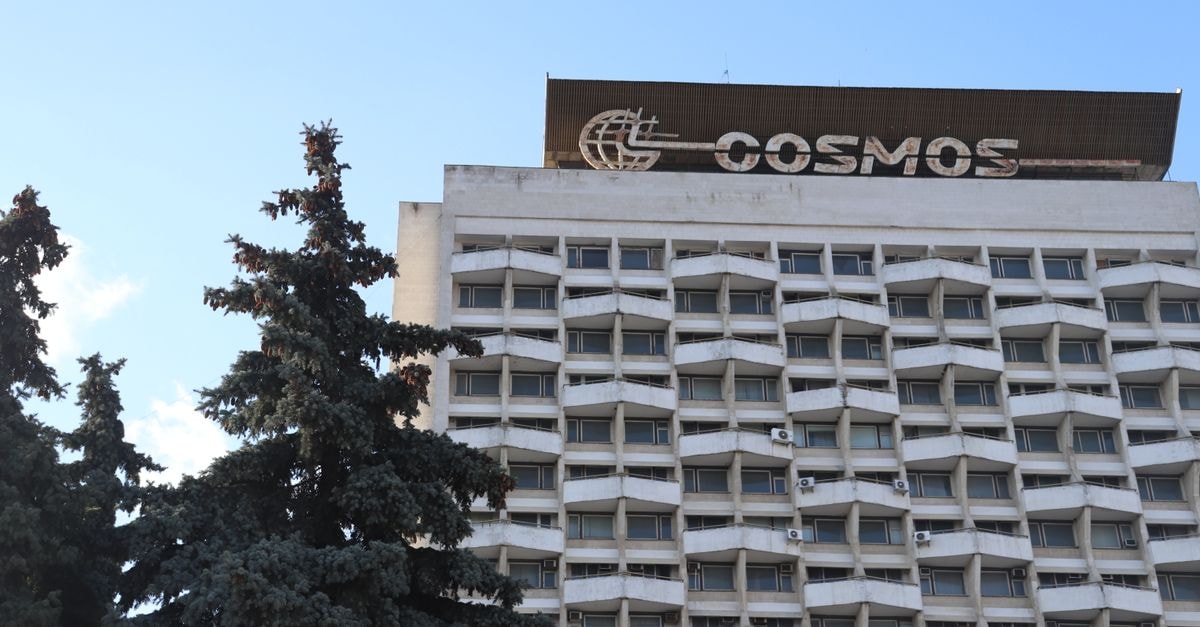 A classic view of the iconic Cosmos Hotel in Chișinău, Moldova against the blue sky.