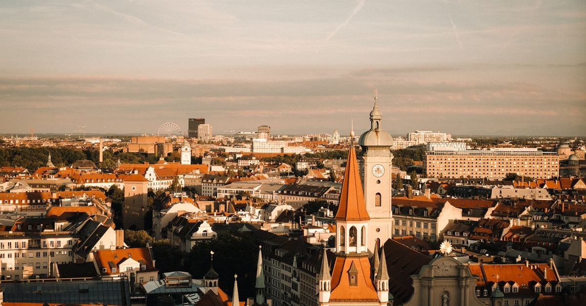 A Quiet Bavarian Companion: A Travel Guide to Fürth Aerial view of Munich showcasing historical buildings and vibrant urban landscape at sunset.