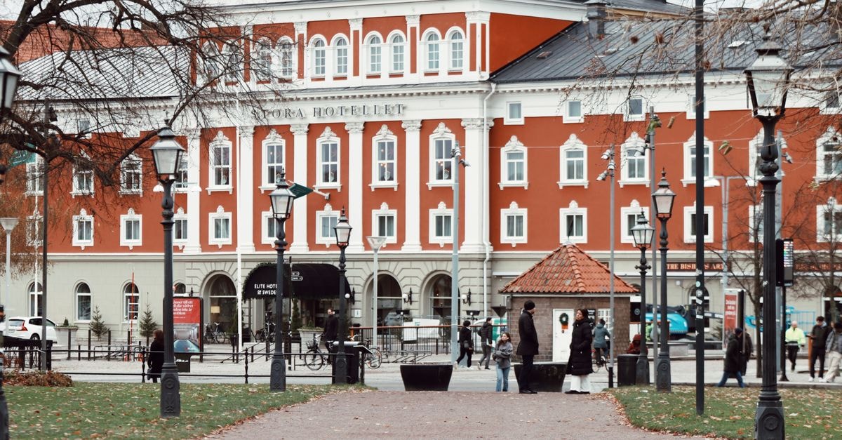 Kouvola Travel Guide: Planning Tips, Costs and Things to Do Charming autumn view of Stora Hotellet in Jönköping, Sweden with people strolling in front.