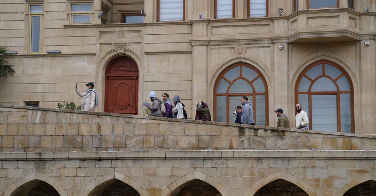 Ndola Travel Guide: The Copperbelt City Worth a Slow Look Tourists walking along a stone walkway of a historic building. Capturing memories and experiences.