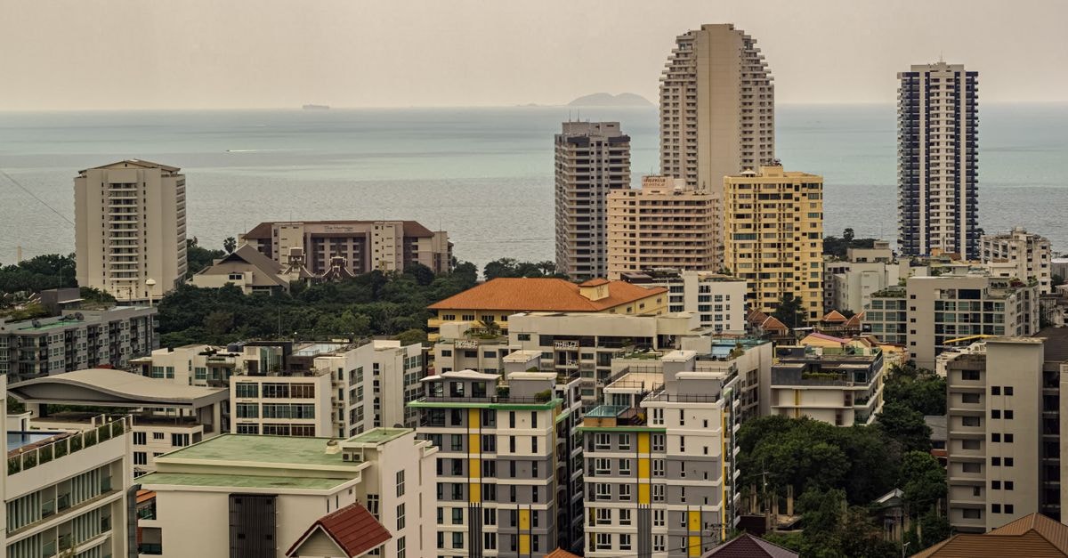 Pattaya Travel Guide: Getting Around, Eating Well, and Planning Smart High-rise buildings overlooking the ocean in Pattaya, Thailand, offering a panoramic view.