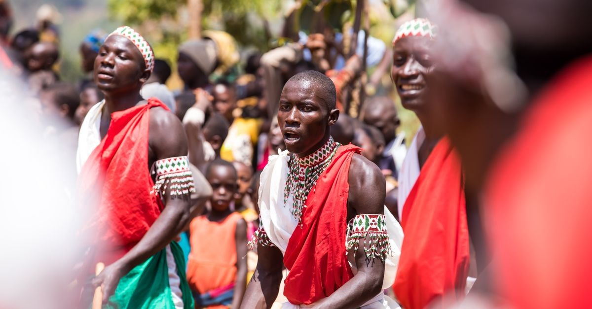 A Quiet Cibitoke Travel Guide: Hillsides, Drumming and Village Flavors Energetic drumming performance with traditional costumes in an outdoor festival setting.