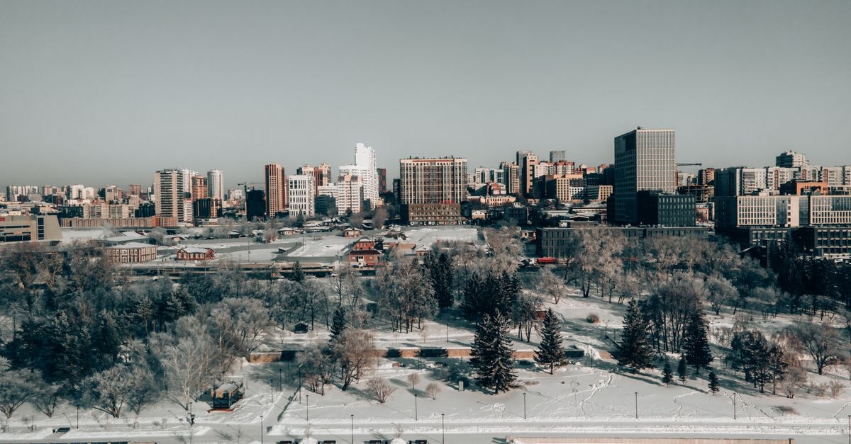 Aerial view of the snow-covered cityscape of Novosibirsk, featuring dramatic winter scenery.